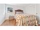 Cozy bedroom with neutral colored walls, wood floors, and ample natural light at 980 Casteel Rd, Powder Springs, GA 30127