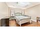 Cozy bedroom with light colored walls and laminate floors and furnishings at 980 Casteel Rd, Powder Springs, GA 30127