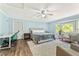 Beautiful bedroom featuring hardwood floors, a ceiling fan, and ample natural light at 980 Casteel Rd, Powder Springs, GA 30127