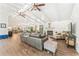 Spacious living room features hardwood floors, a stone fireplace, and access to the dining area at 980 Casteel Rd, Powder Springs, GA 30127