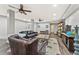 Finished basement area with laminate wood floors, dark leather sofas, and a wet bar at 980 Casteel Rd, Powder Springs, GA 30127