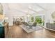 Bright and airy living space with hardwood flooring, dining area and large window with nature views at 980 Casteel Rd, Powder Springs, GA 30127