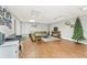Finished basement space with laminate wood floors, an entertainment area, and a comfortable sitting area at 980 Casteel Rd, Powder Springs, GA 30127