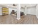 Finished basement area with laminate wood floors, large seating area, and an entertainment center at 980 Casteel Rd, Powder Springs, GA 30127