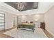 Serene main bedroom featuring a decorative ceiling and accent lighting at 980 Casteel Rd, Powder Springs, GA 30127