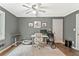 Home office featuring a neutral color palette, modern desk, and laminate floors at 980 Casteel Rd, Powder Springs, GA 30127