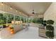 Covered patio with outdoor seating, string lights, and a view of the fenced backyard at 980 Casteel Rd, Powder Springs, GA 30127