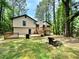 Expansive backyard features a spacious deck and mature trees for shade and privacy at 2816 Quinbery Dr, Snellville, GA 30039