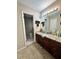 Bathroom featuring granite countertop and a single vanity, with an adjoining separate toilet room at 2816 Quinbery Dr, Snellville, GA 30039