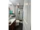 Modern bathroom with updated vanity, mirror and shower with decorative shower curtain at 2816 Quinbery Dr, Snellville, GA 30039