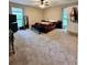 Cozy bedroom with carpeted floor, ceiling fan, and lots of natural light from the windows at 2816 Quinbery Dr, Snellville, GA 30039