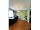 Bright dining room with hardwood floors and a modern chandelier fixture, next to the kitchen at 2816 Quinbery Dr, Snellville, GA 30039