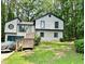Charming two-story home featuring a front porch with wood accents and a serene wooded surrounding at 2816 Quinbery Dr, Snellville, GA 30039