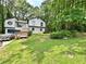 Exterior view of the home showcases lush landscaping and a well-manicured lawn at 2816 Quinbery Dr, Snellville, GA 30039