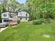View of the home's lush green front yard and the home's charming exterior at 2816 Quinbery Dr, Snellville, GA 30039