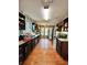 View of a long kitchen featuring granite countertops, stainless steel appliances, and wood-look flooring at 2816 Quinbery Dr, Snellville, GA 30039