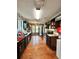 View of a long kitchen featuring granite countertops, stainless steel appliances, and wood-look flooring at 2816 Quinbery Dr, Snellville, GA 30039