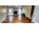 Bright living room featuring a stone fireplace, hardwood floors, and a door to the yard at 2816 Quinbery Dr, Snellville, GA 30039