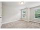 Cozy bedroom with neutral walls, carpet flooring, and natural light at 2817 White Oak Ln, Decatur, GA 30032