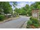 Welcoming entrance to White Oak at East Lake, with a gated entry and lush landscaping at 2817 White Oak Ln, Decatur, GA 30032