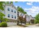 View of townhomes featuring neutral exteriors, garage parking, and well-maintained landscaping in front at 2817 White Oak Ln, Decatur, GA 30032