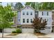 Charming townhome featuring a gray exterior with a brick facade and a one-car garage at 2817 White Oak Ln, Decatur, GA 30032