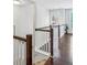 Bright hallway with hardwood floors, white wainscoting, and a stylish pendant light at 2817 White Oak Ln, Decatur, GA 30032