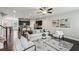 Open living room with hardwood floors flows into the kitchen with a breakfast bar at 2817 White Oak Ln, Decatur, GA 30032