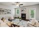 Bright living room features a fireplace, ceiling fan, and modern decor at 2817 White Oak Ln, Decatur, GA 30032