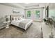 Serene main bedroom with tray ceiling, plush carpet, and bright natural light at 2817 White Oak Ln, Decatur, GA 30032