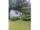 Light blue two-story home with green lawn and mature trees in the yard at 2939 Carrie Farm Nw Rd, Kennesaw, GA 30144