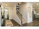 Inviting foyer with a staircase, decorative accents, and wood-look flooring, leading into the home's interior at 3050 Yellowhammer Dr, Marietta, GA 30064