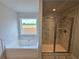 Bright bathroom features a soaking tub next to a shower with marble patterned tile at 702 Bristol Dr, Loganville, GA 30052
