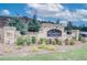 Stone community entrance sign surrounded by lush greenery, creating an inviting and sophisticated entry point at 702 Bristol Dr, Loganville, GA 30052