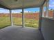 Covered patio provides outdoor living space with a view of the landscaped backyard at 702 Bristol Dr, Loganville, GA 30052