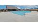 Community swimming pool with a bath house and nearby new construction neighborhood at 702 Bristol Dr, Loganville, GA 30052