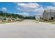 Neighborhood street showcasing community entrance signs and well-maintained landscaping for a warm welcome at 702 Bristol Dr, Loganville, GA 30052