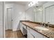 Bathroom featuring a double vanity and a full mirror at 1235 Waterwood Dr, Loganville, GA 30052