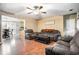 Comfortable living room area with wood floors open to dining room at 1235 Waterwood Dr, Loganville, GA 30052