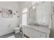 Bright bathroom with a stylish vanity, marble countertop, and elegant mirror at 3718 Lake Vis, Douglasville, GA 30135