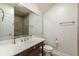 Neutral bathroom featuring a framed mirror, vanity with storage, and a toilet at 3718 Lake Vis, Douglasville, GA 30135