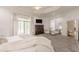 The spacious primary suite has plush carpeting, a sitting area, balcony access, and a large closet at 3718 Lake Vis, Douglasville, GA 30135