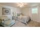 Cozy bedroom with soft carpet, chair, decorative pillows, and natural light at 3718 Lake Vis, Douglasville, GA 30135