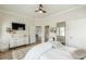 Well-lit bedroom with neutral tones, featuring a dresser and decor at 3718 Lake Vis, Douglasville, GA 30135