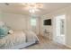 Bright bedroom featuring plush carpet, soft blue accents, and a view into an ensuite bathroom at 3718 Lake Vis, Douglasville, GA 30135