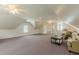 Versatile bonus room showcasing a cozy seating area, plush carpeting, and an abundance of natural light at 3718 Lake Vis, Douglasville, GA 30135