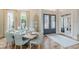 Dining room with a set table, adjacent to the foyer, and a view of the front entrance at 3718 Lake Vis, Douglasville, GA 30135
