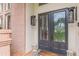 Elegant front door with decorative glass, flanked by sconces, and a welcoming doormat at 3718 Lake Vis, Douglasville, GA 30135