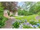A well-manicured front yard with lush landscaping and blooming hydrangeas gives the home great curb appeal at 3718 Lake Vis, Douglasville, GA 30135