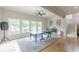 Bright game room with hardwood floors, ping pong table and large windows at 3718 Lake Vis, Douglasville, GA 30135